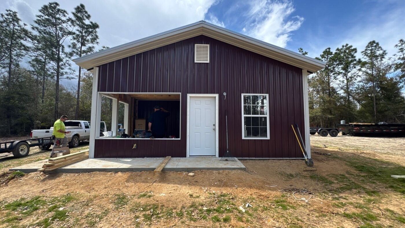 Custom metal-sided barndominium built in Northwest Florida by JB's Contracting