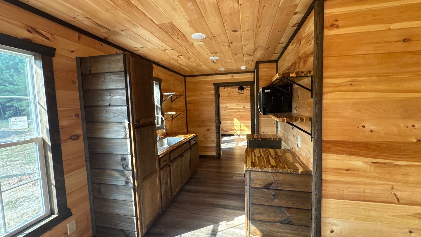 Barndominium kitchenette with custom wood cabinetry