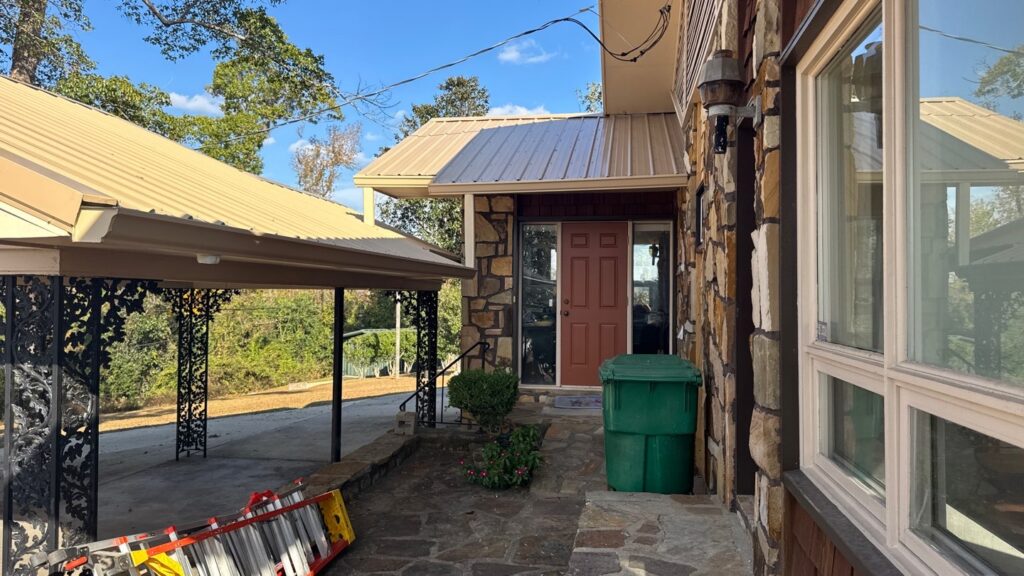 Completed carport addition and front entry remodel with stone accents in Marianna, FL