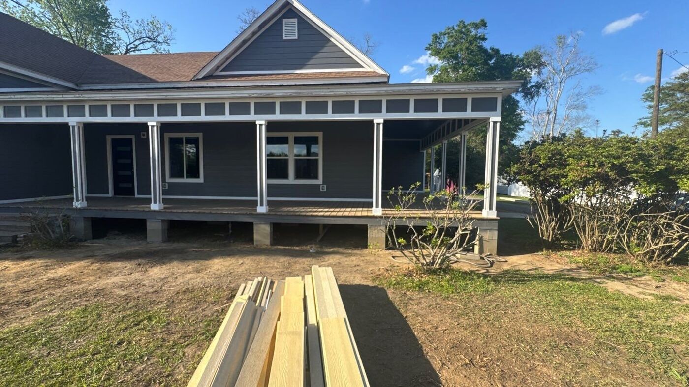 Custom craftsman home with a full front porch and gray siding, Northwest Florida — JB's Contracting