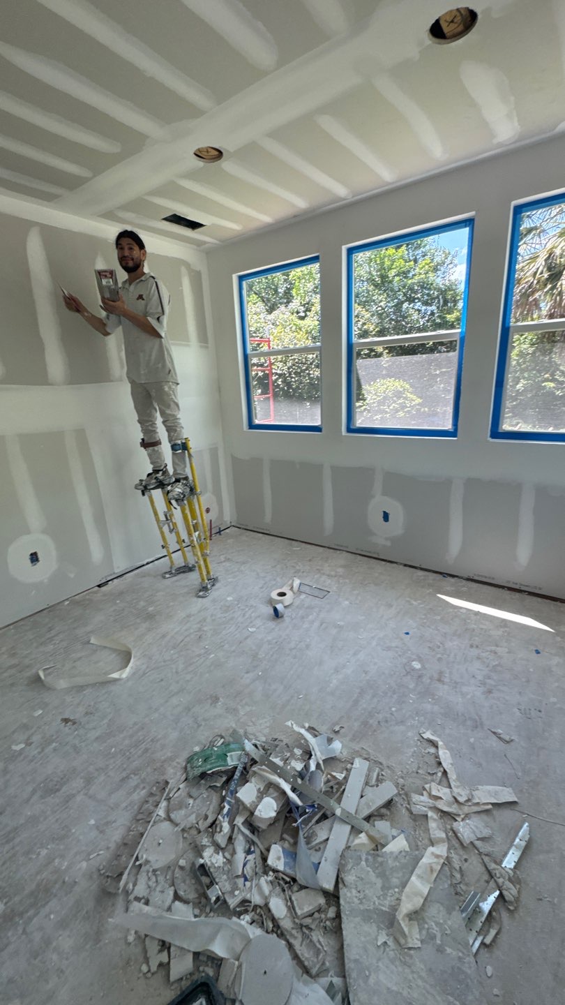 JB’s crew finishing drywall during a whole-home renovation in Marianna, FL