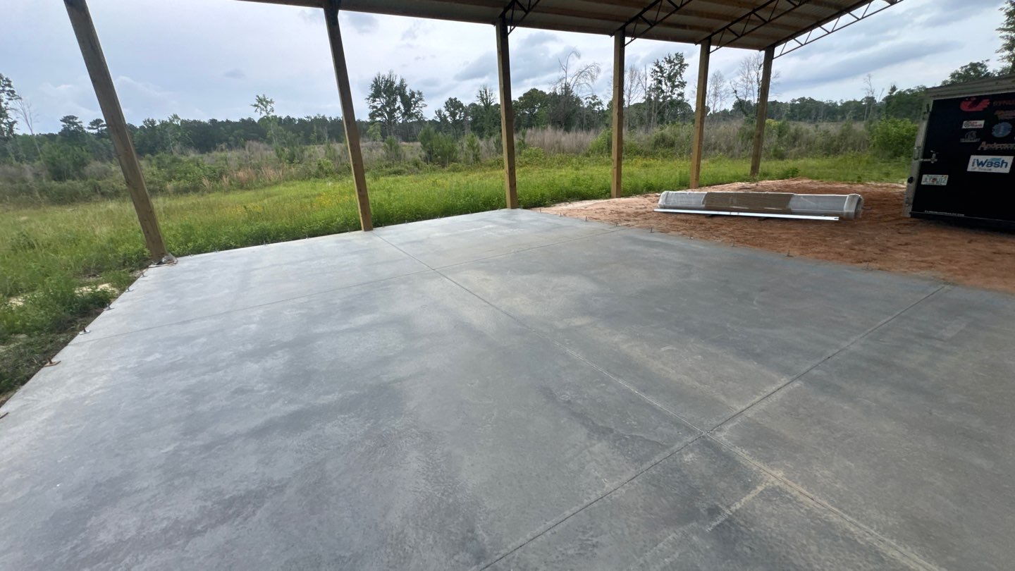New pole barn with fresh finished concrete slab in Westville, FL