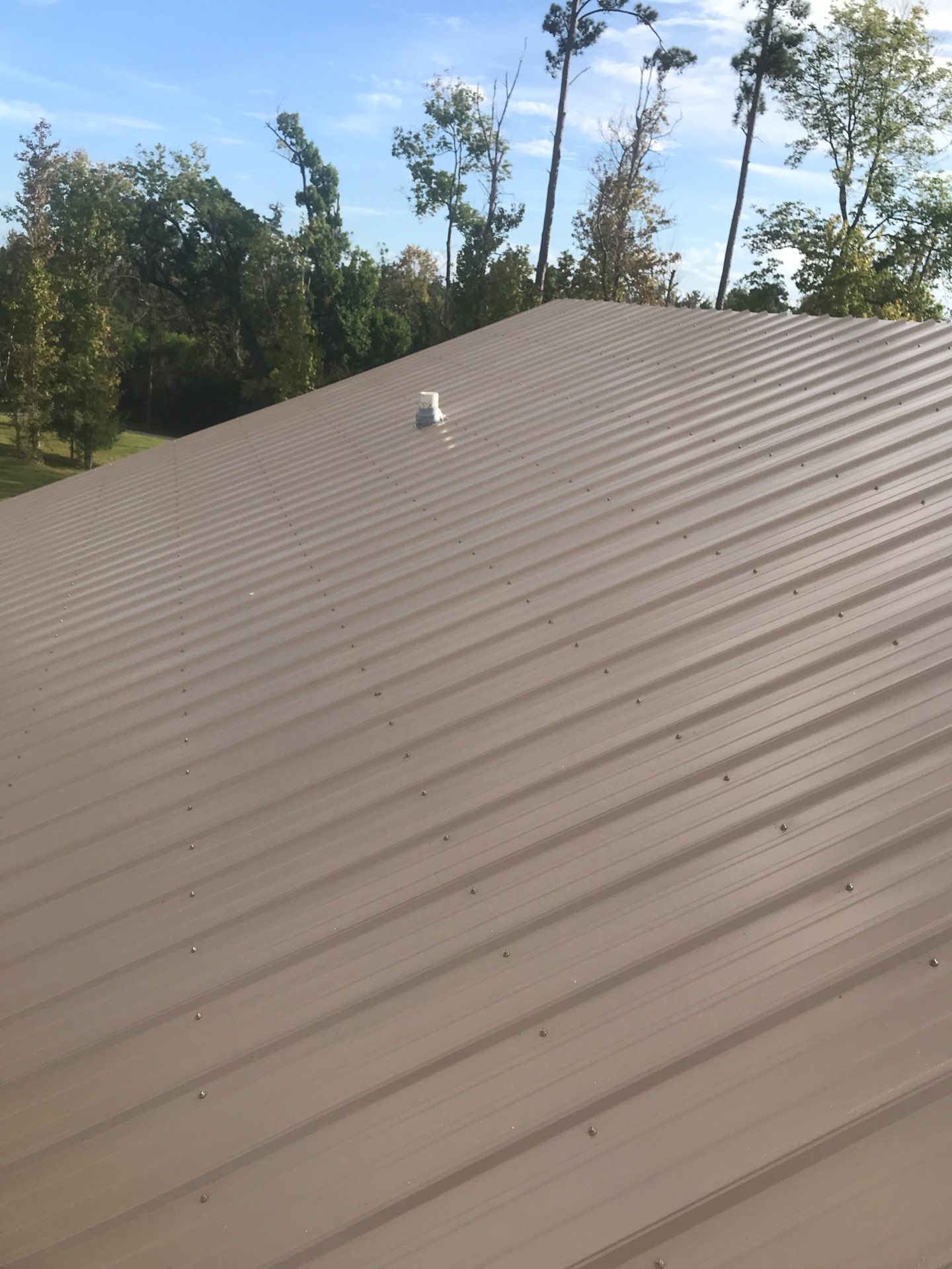 Pipe boot and flashing detail on metal roof