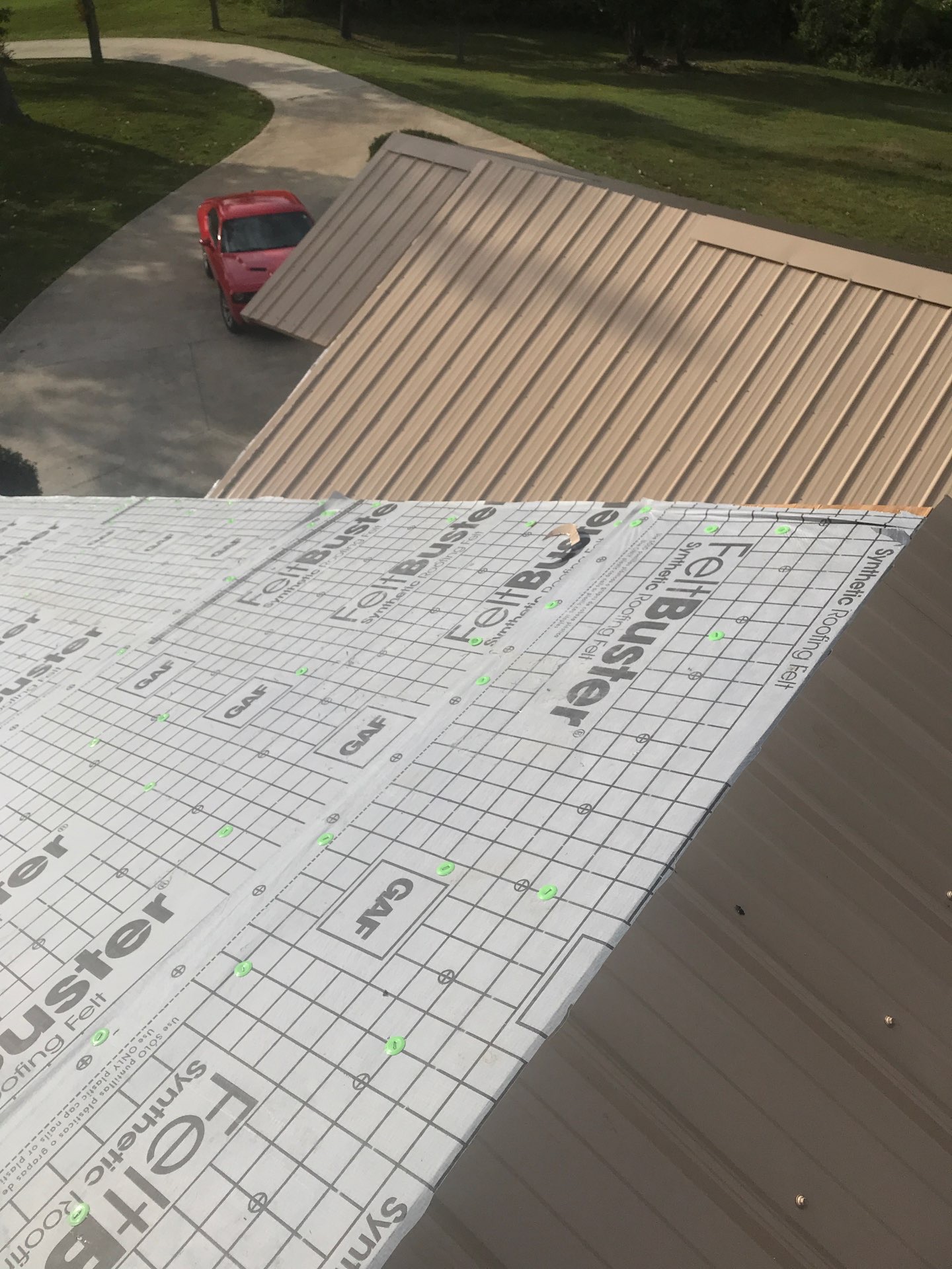 Synthetic roof underlayment installation before metal panels