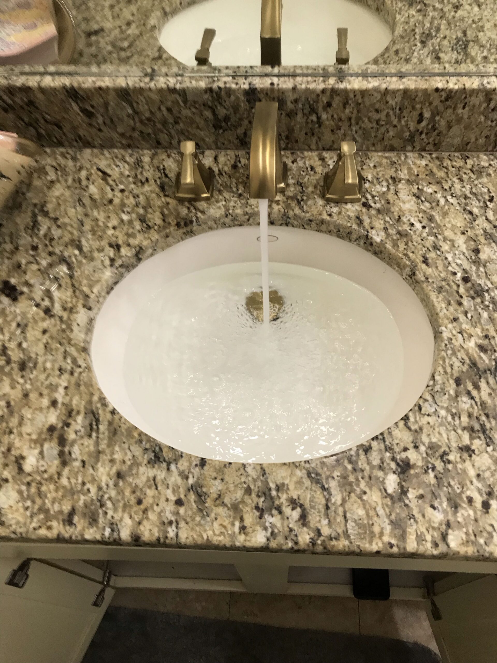 Bathroom faucet with water running