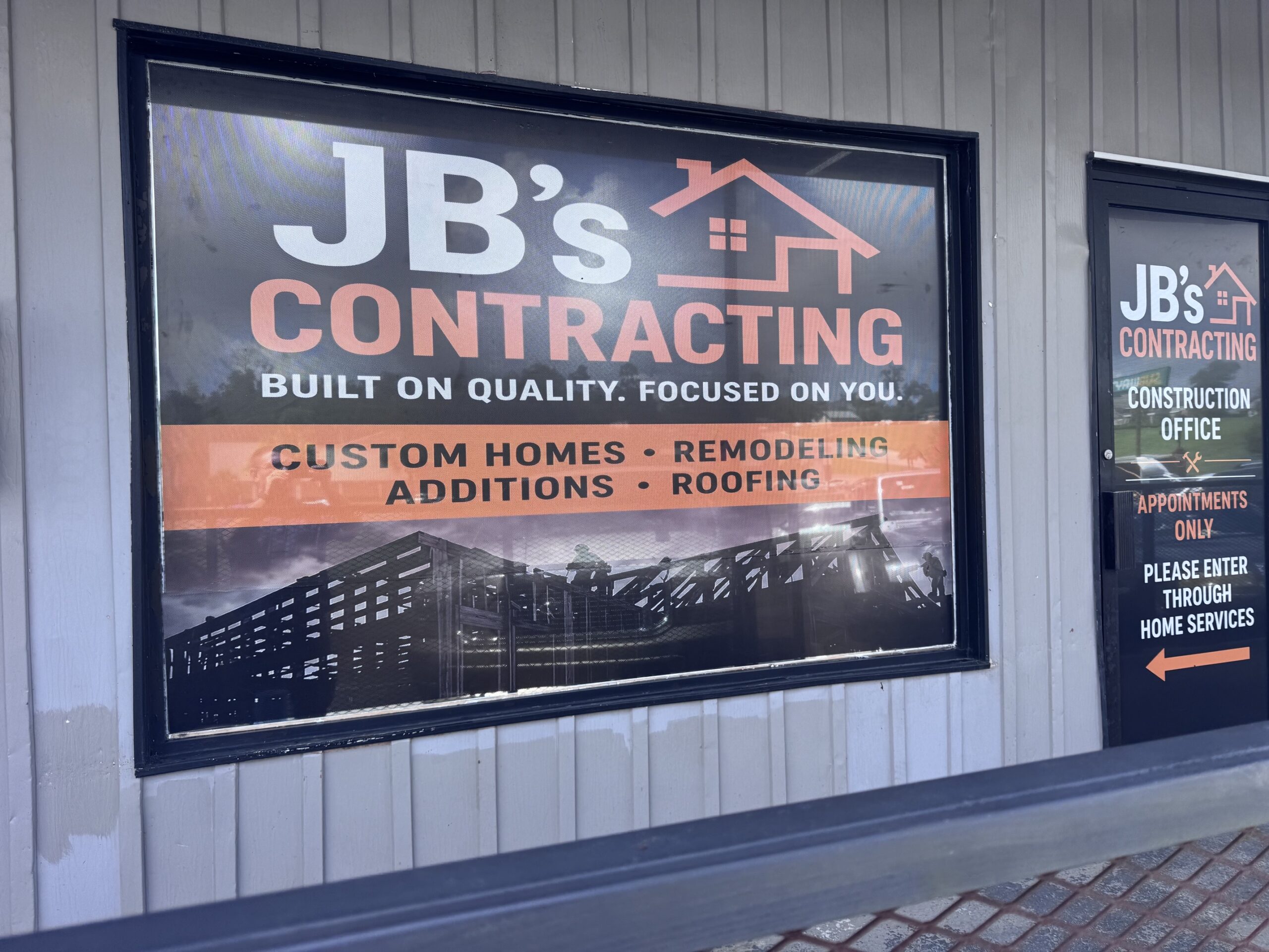 JB’s Contracting office window