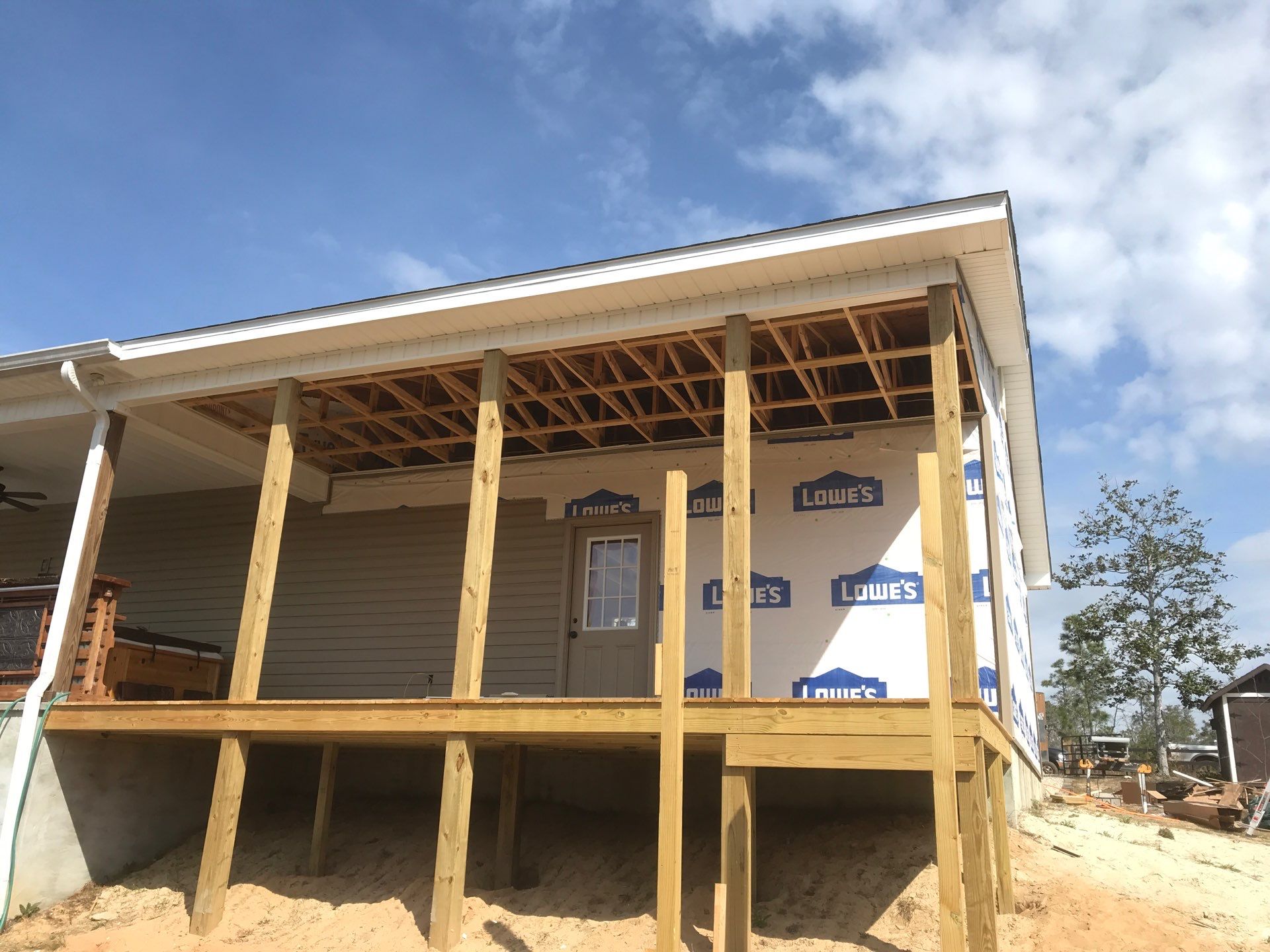 Covered porch and siding during construction