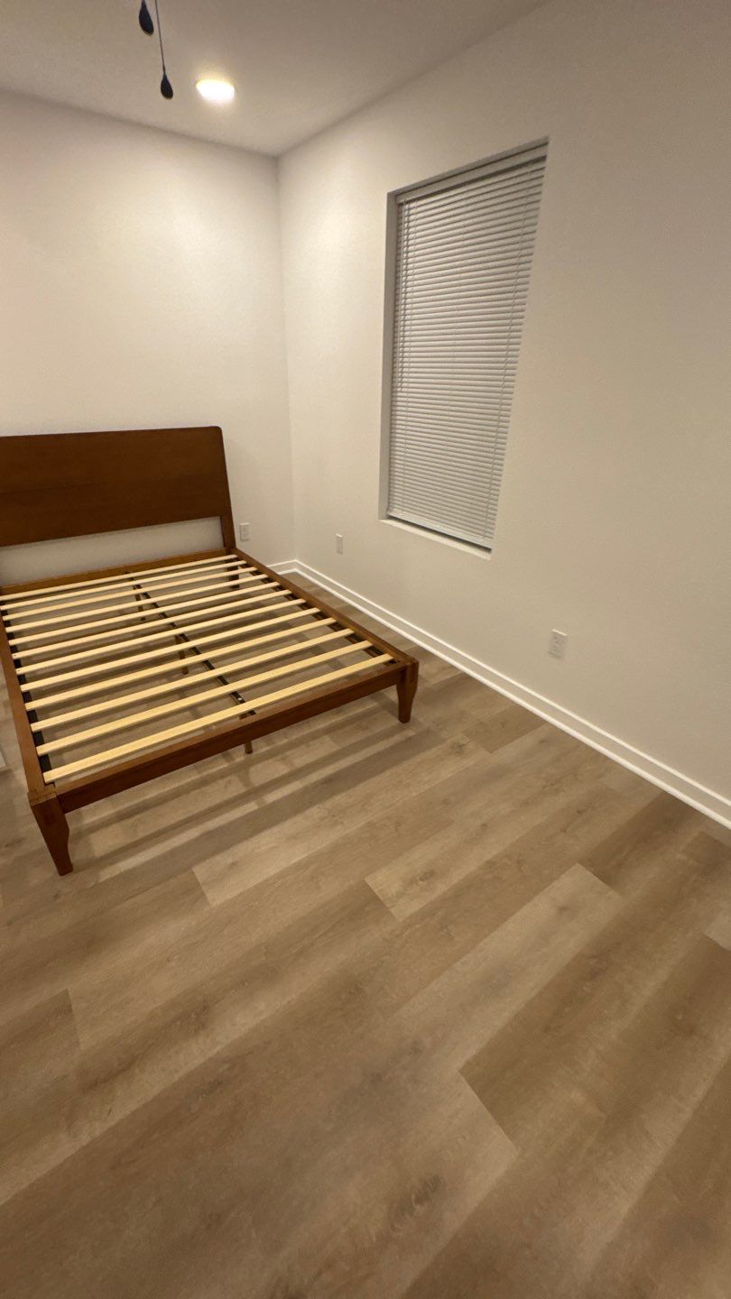 Bedroom flooring, trim and built-in bed frame
