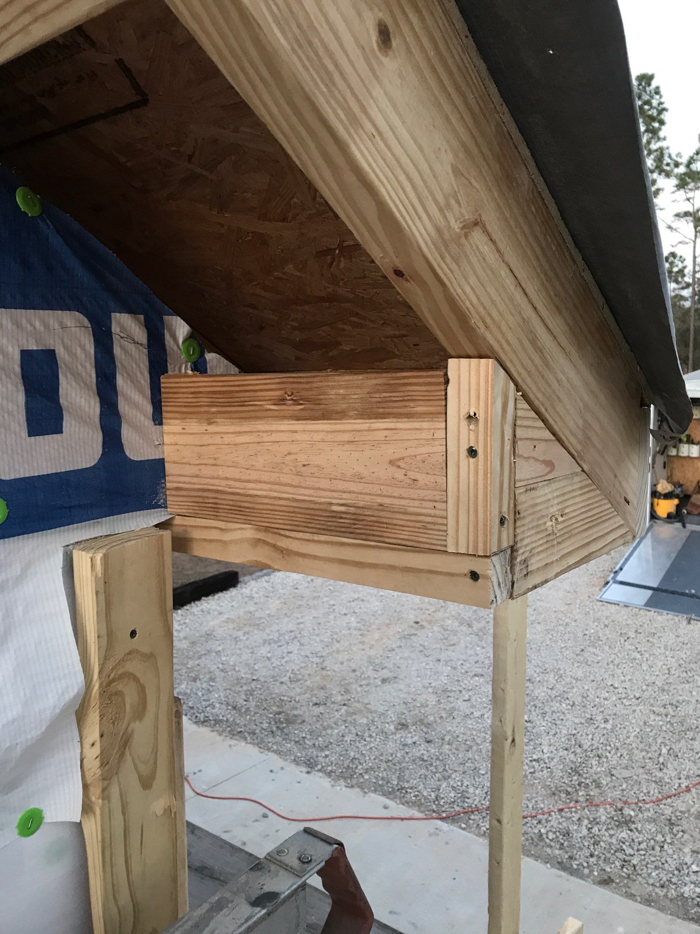 Wood eave framing before trim