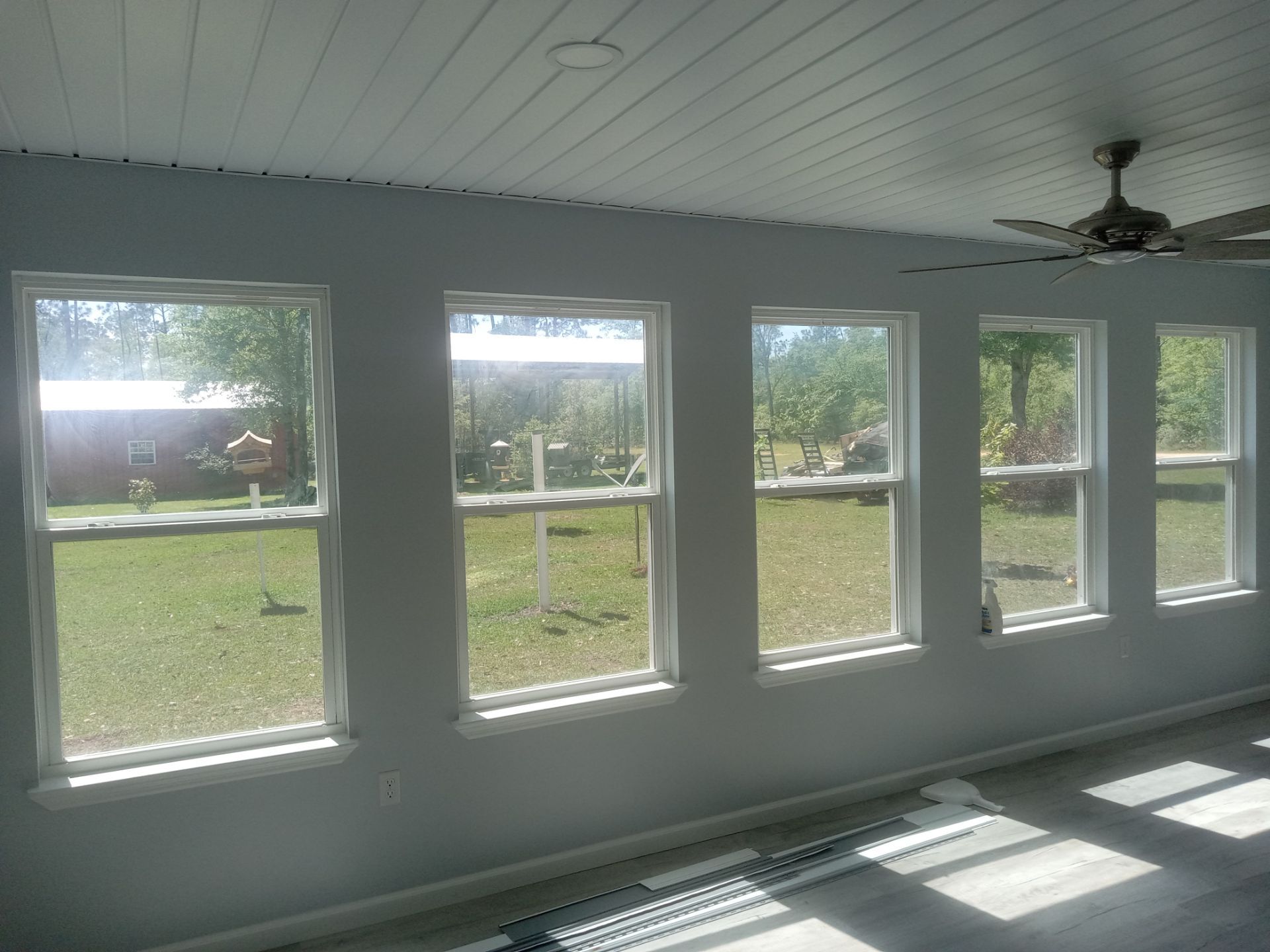 Window-lined Florida room interior during finishing