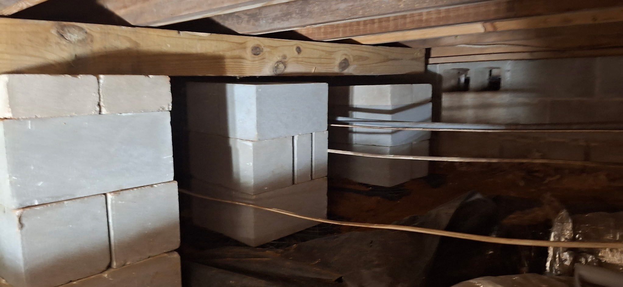 Concrete-block supports beneath floor framing