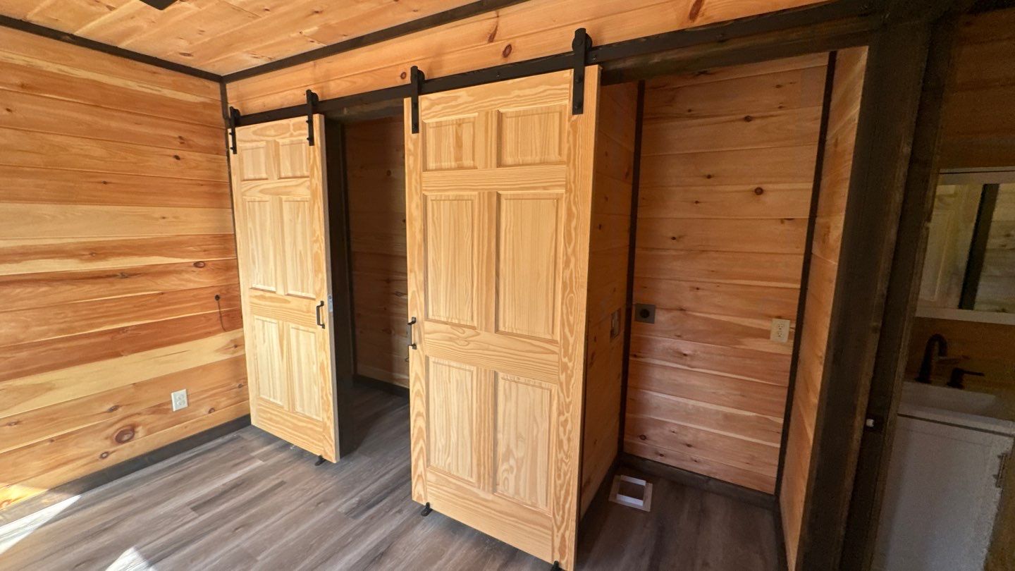 Sliding doors in a wood-lined room