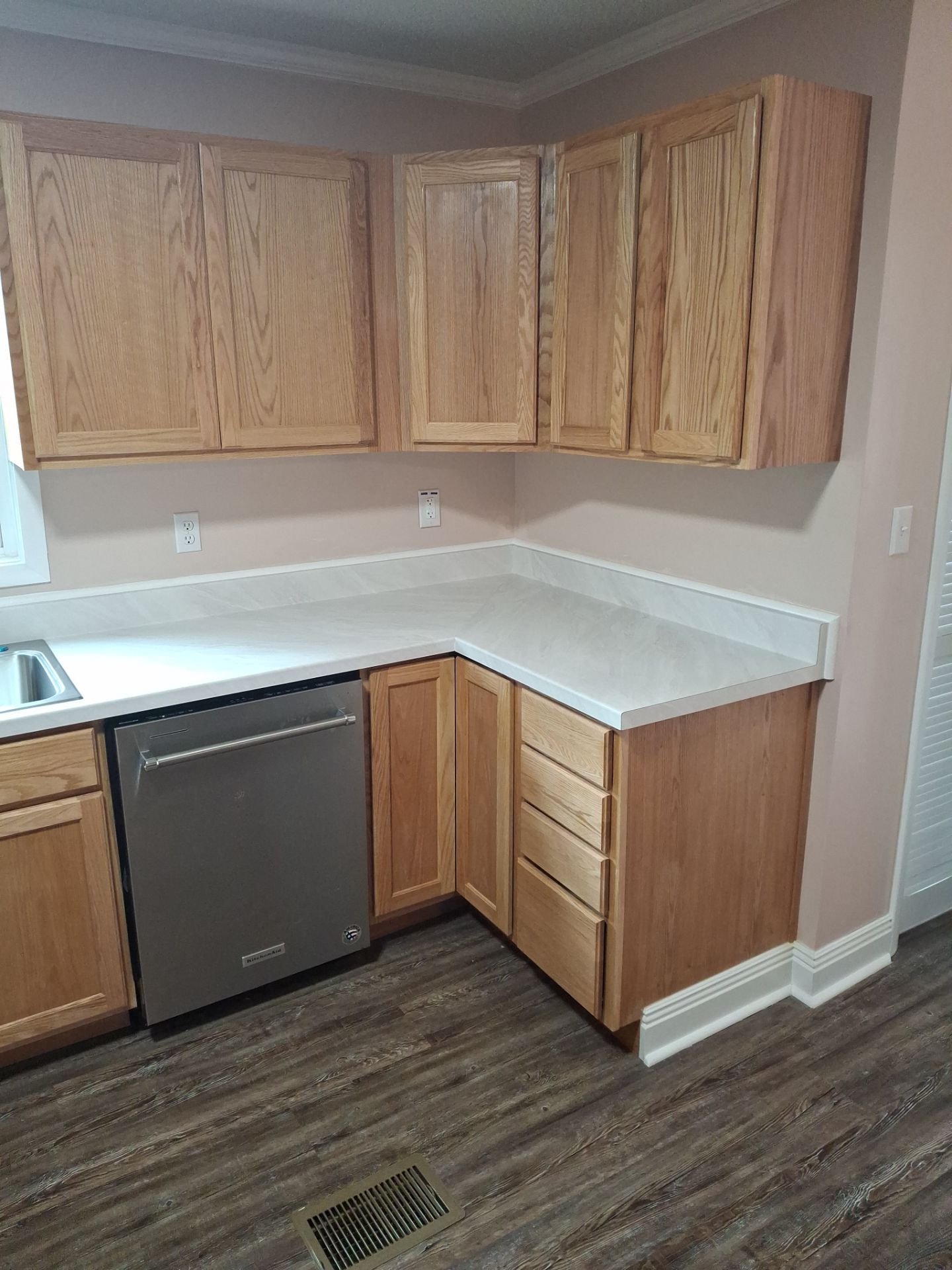 Wood kitchen cabinets and corner countertop