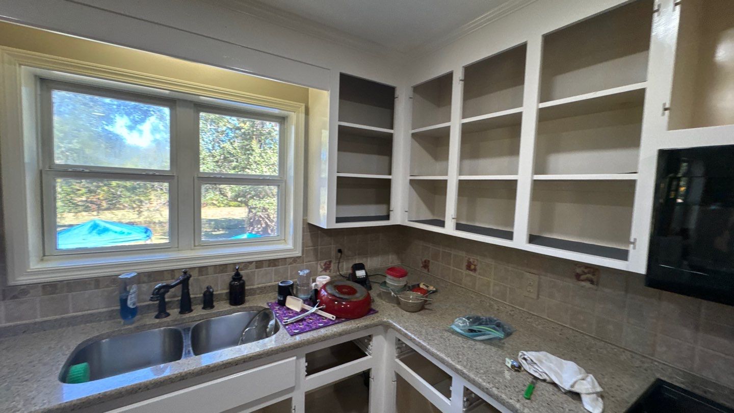 Cabinet work around a kitchen sink