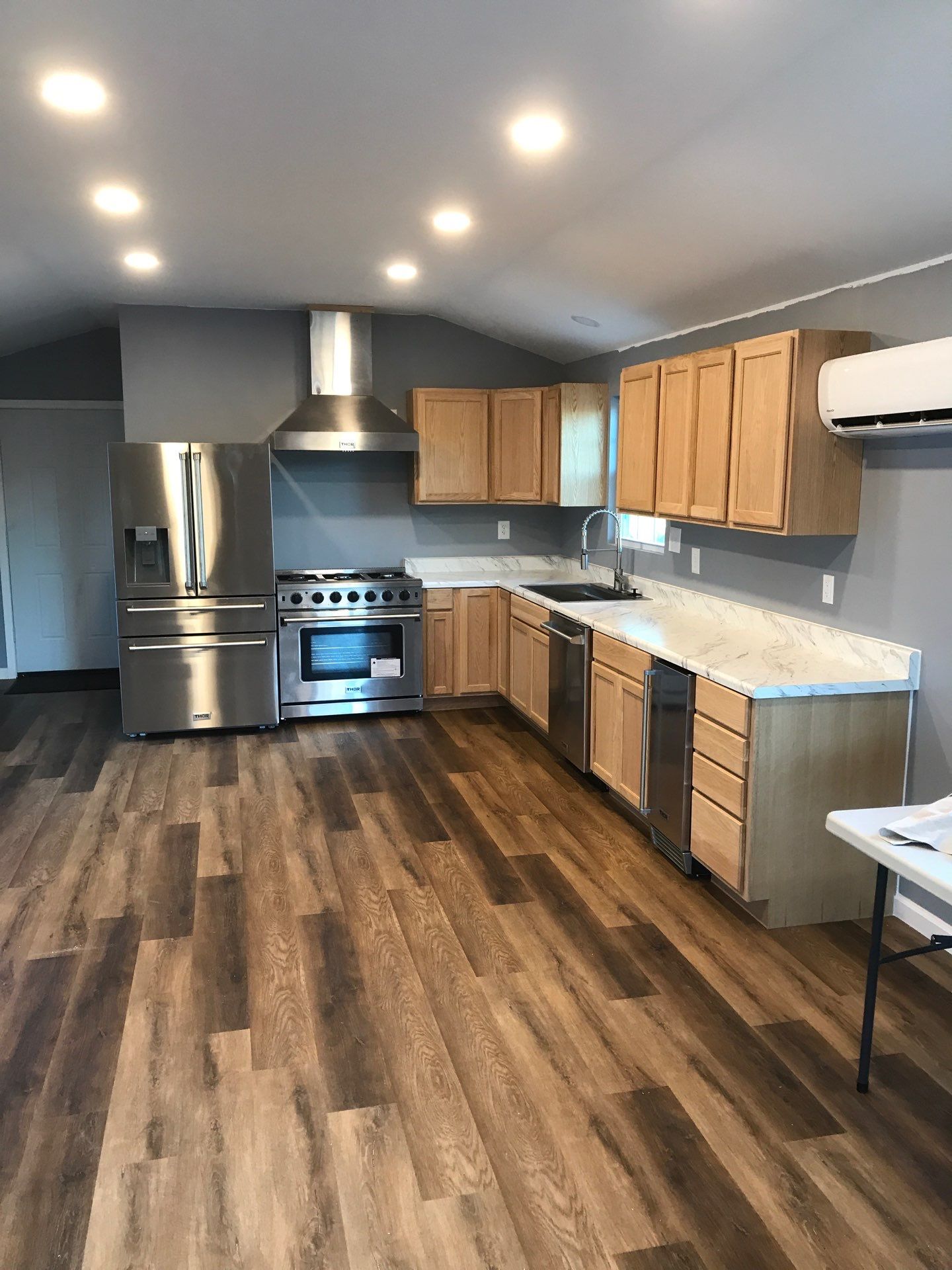 Kitchen with wood cabinets and range hood