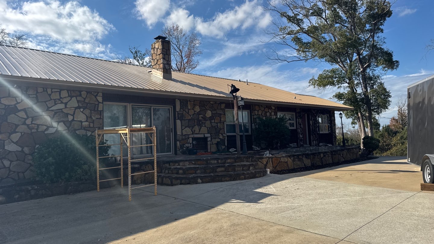 Metal roof across a stone exterior