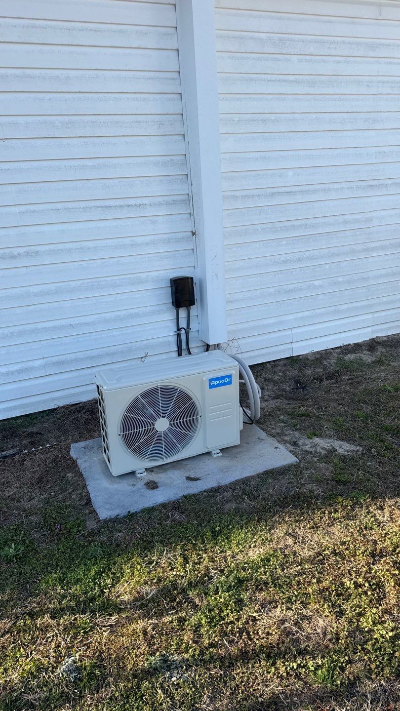 Mini-split outdoor unit on a pad