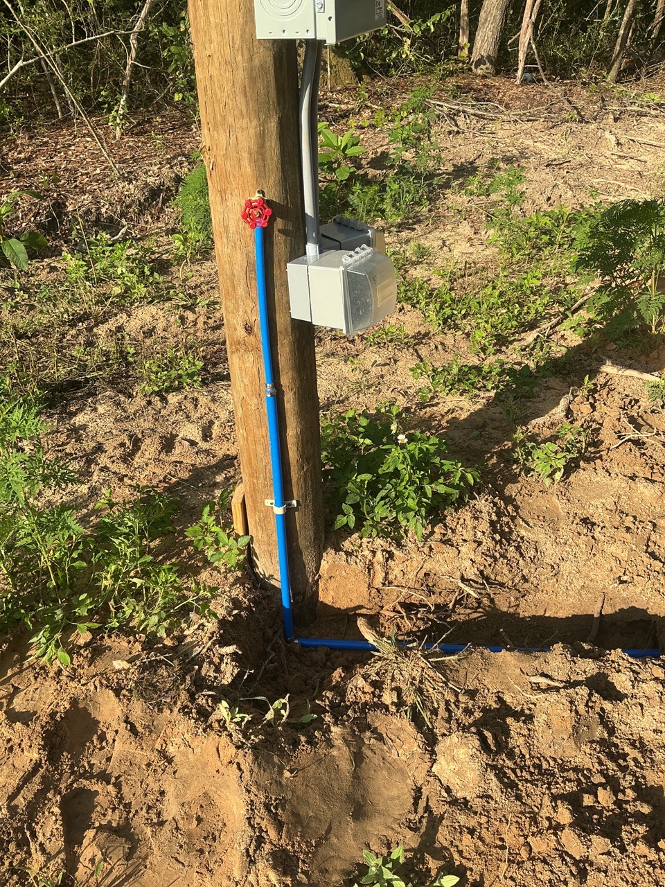 Outdoor water line and hose connection in progress