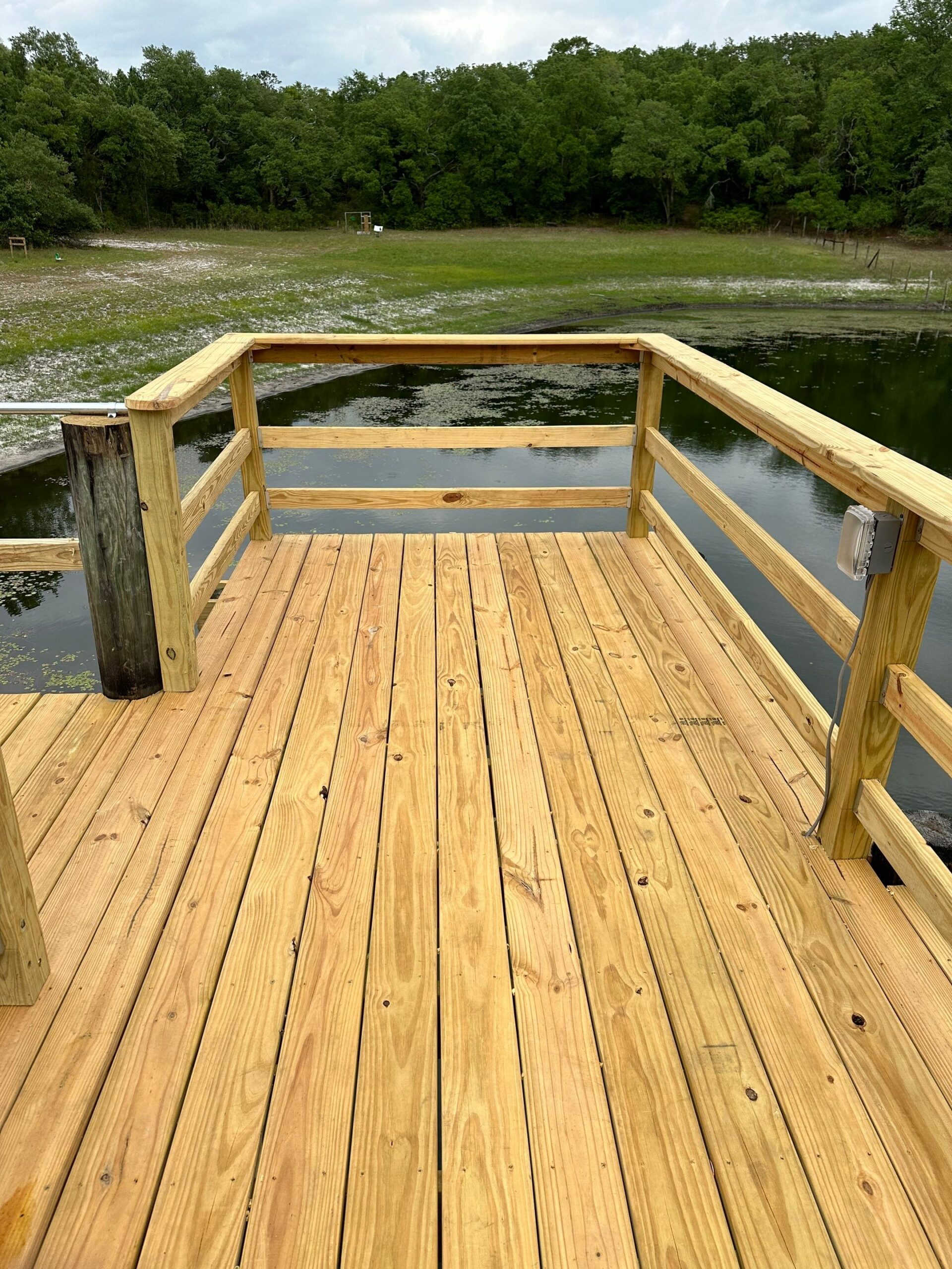 Wood decking and railing detail on a rebuilt dock