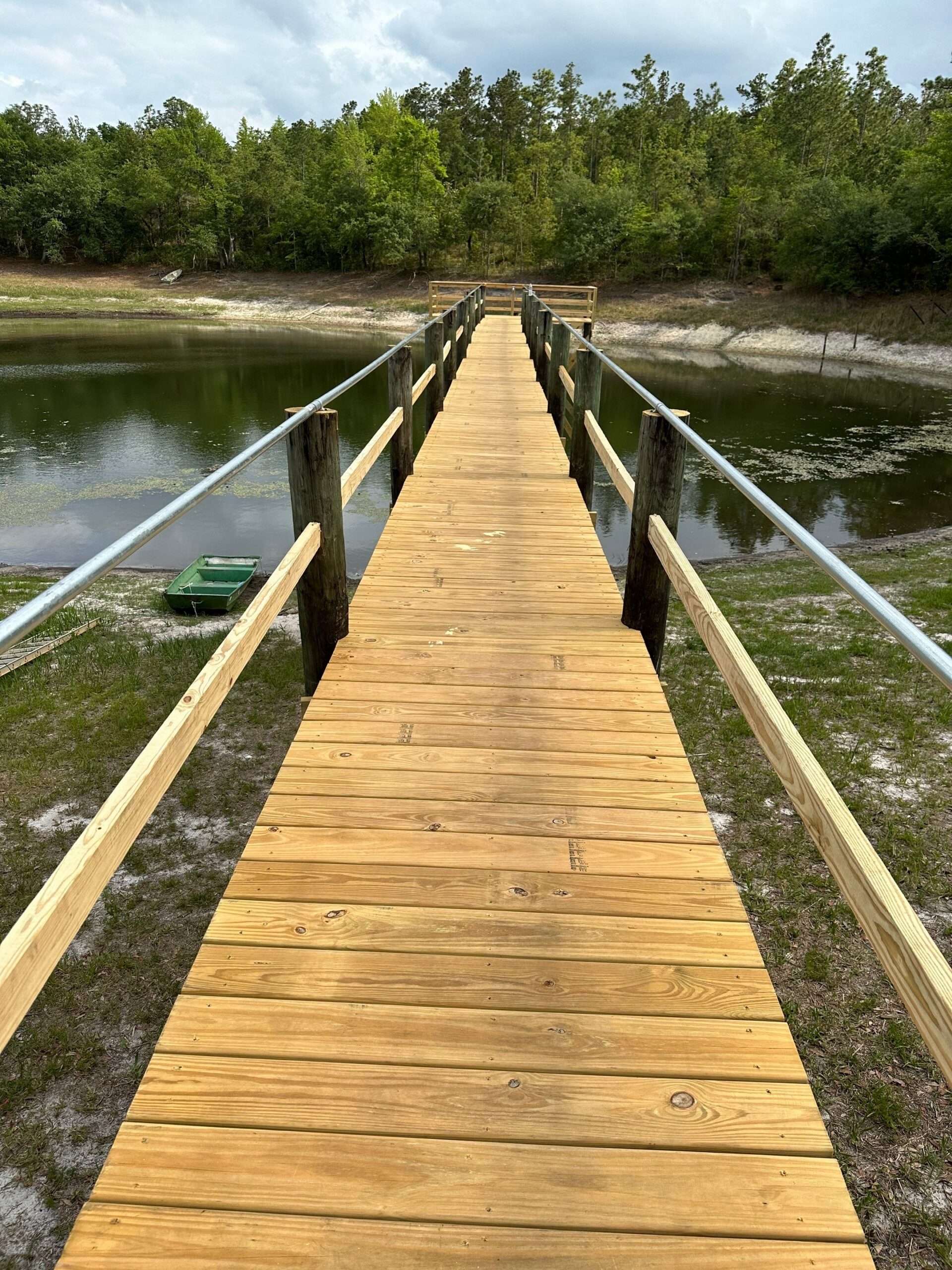 Wood walkway and railings on a rebuilt dock