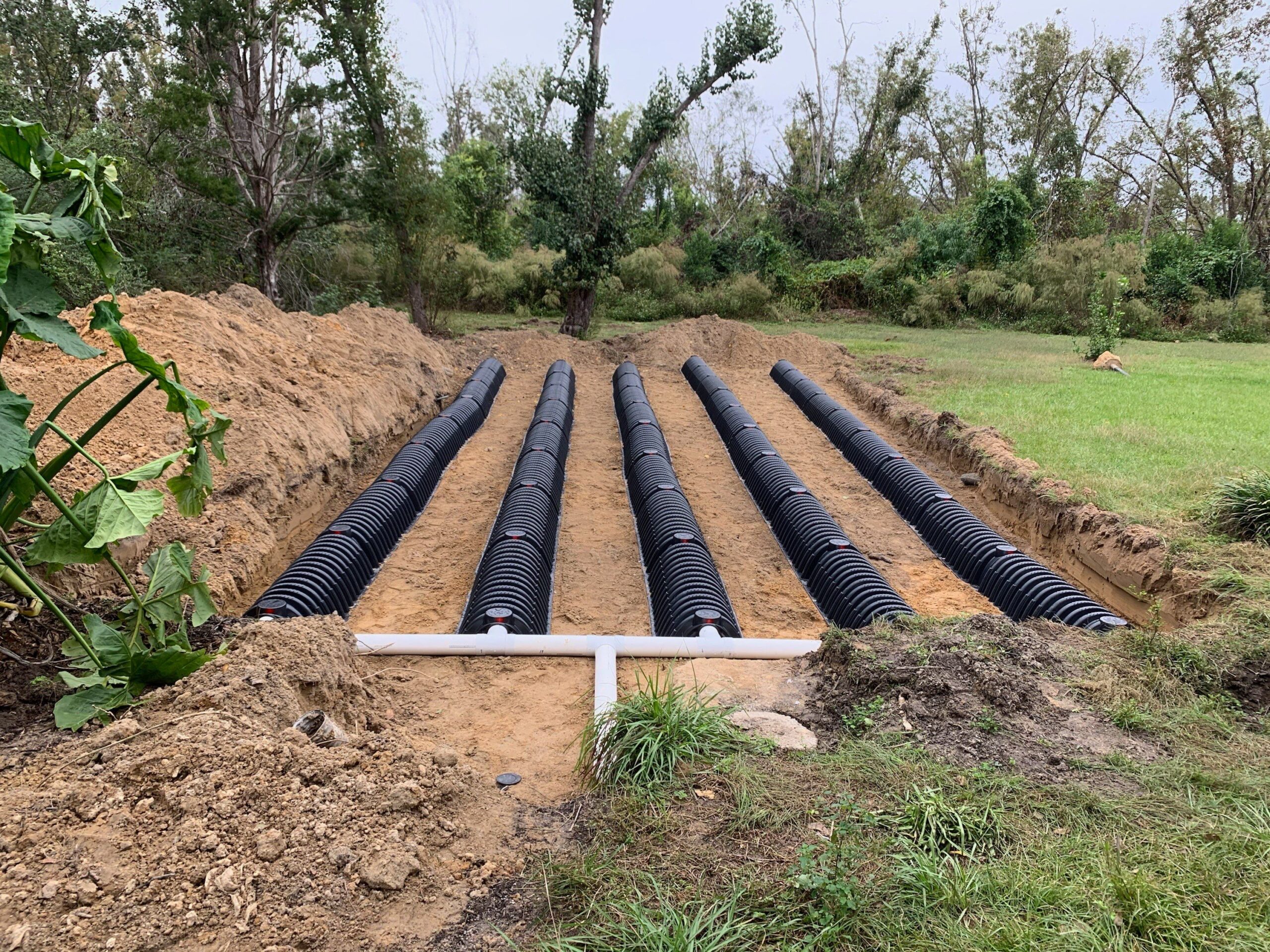 Drain-field chambers and connecting pipe before backfilling