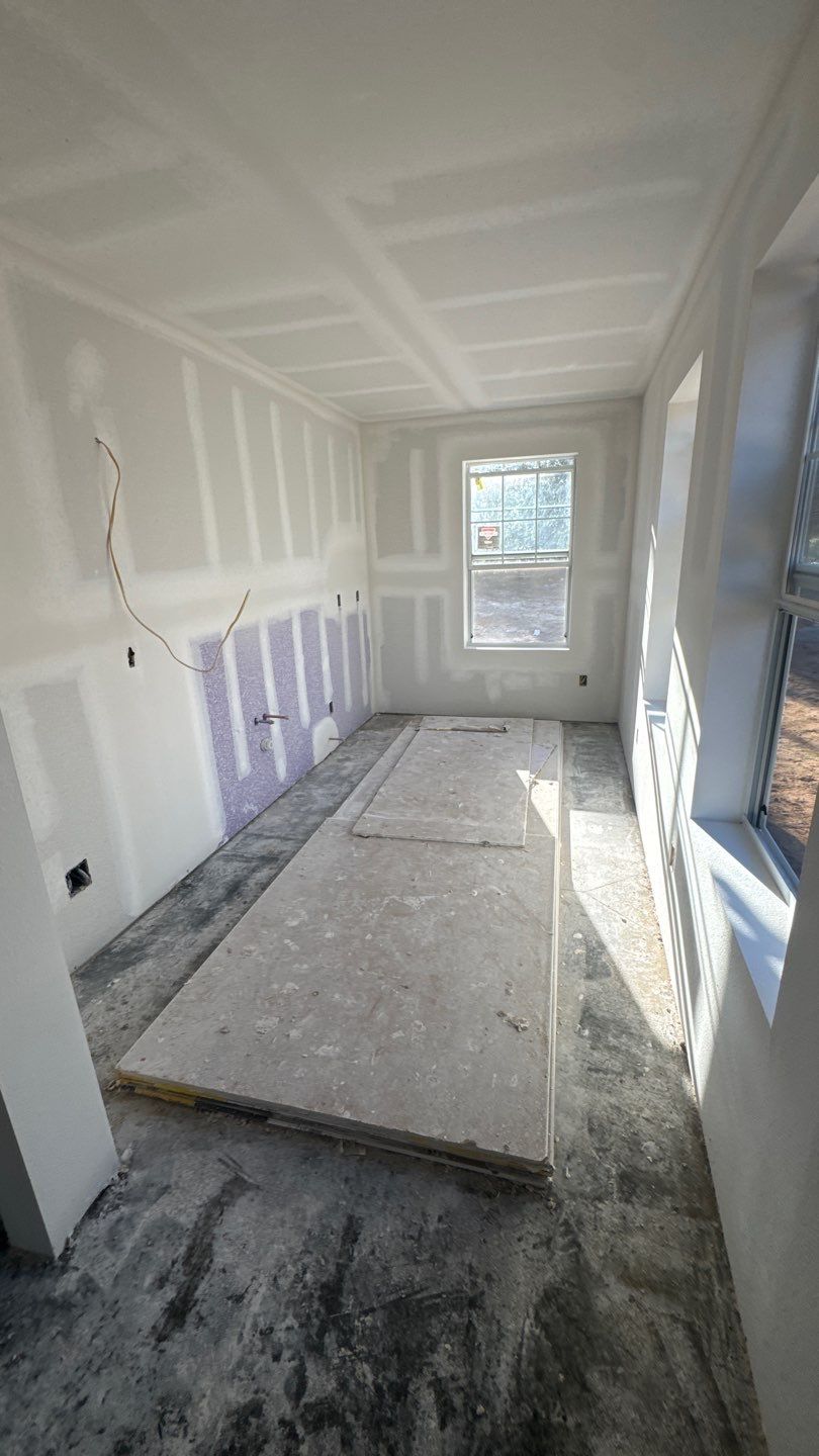 Galley kitchen during drywall and rough-in work