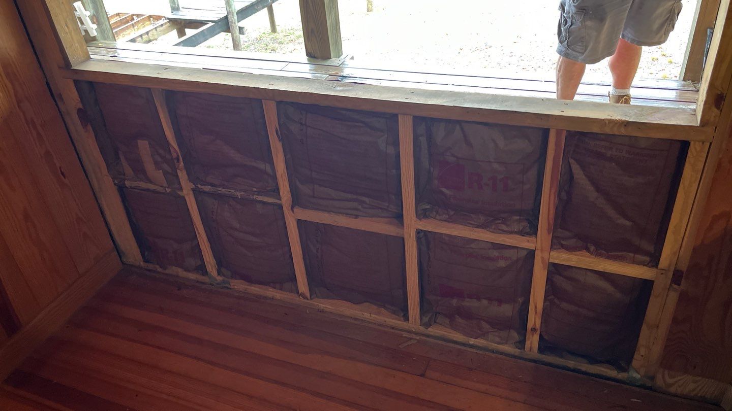 Open wall beneath a window during a French-door conversion